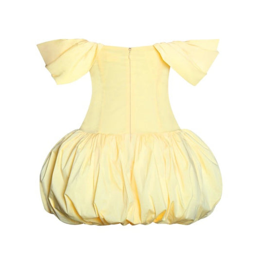 Yellow baby romper with ruffled sleeves on a white background