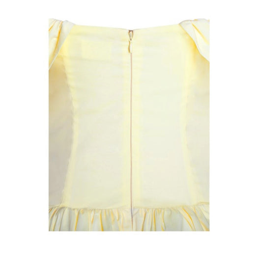 Light yellow dress with a subtle pattern on a white background