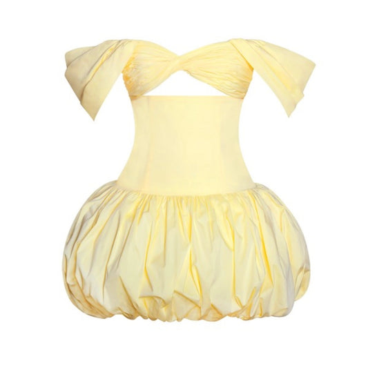 Yellow dress with a bow on a white background